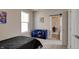 Cozy bedroom with a twin bed, dresser, and access to another room at 15994 Meadow Frost Ct, Fishers, IN 46037