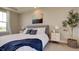 Main bedroom with large windows, dresser, and neutral color palette at 15994 Meadow Frost Ct, Fishers, IN 46037