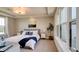 Bedroom with large windows, comfortable bed, and neutral decor at 15994 Meadow Frost Ct, Fishers, IN 46037