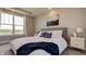 Bright bedroom with large windows, plush bedding, and neutral decor at 15994 Meadow Frost Ct, Fishers, IN 46037