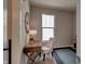 Home office with a desk, chair, and natural light from a large window at 15994 Meadow Frost Ct, Fishers, IN 46037