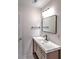 Stylish bathroom with a single sink vanity, sleek fixtures, and a framed mirror at 1753 Skyline Dr, Greenwood, IN 46143