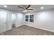 Neutral bedroom with a ceiling fan, carpet, and a window bringing in ample natural light at 1753 Skyline Dr, Greenwood, IN 46143