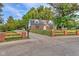 Charming brick home featuring a well-manicured front yard and a long driveway with curb appeal at 1753 Skyline Dr, Greenwood, IN 46143