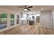Spacious kitchen with stainless appliances, white cabinets, and gray island, flowing into a living area at 1753 Skyline Dr, Greenwood, IN 46143