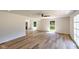 Open living room featuring wood floors, two large windows, and neutral walls at 1753 Skyline Dr, Greenwood, IN 46143