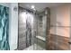 Modern shower with glass doors, a built-in bench, and stylish tile creates a luxurious experience at 1753 Skyline Dr, Greenwood, IN 46143