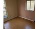 Bedroom with hardwood floors and two-toned walls at 1908 Edgemont Way, Anderson, IN 46011