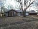 Ranch style home with attached garage and mature tree in front yard at 1908 Edgemont Way, Anderson, IN 46011