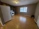 Eat-in kitchen with white appliances and ample natural light at 1908 Edgemont Way, Anderson, IN 46011