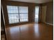 Bright living room featuring hardwood floors and large windows at 1908 Edgemont Way, Anderson, IN 46011