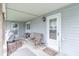 A covered back porch with seating, an entrance, and grill at 310 Green St, Plainfield, IN 46168