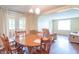 A dining room featuring a round table with seating and hardwood floors at 310 Green St, Plainfield, IN 46168
