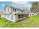 A cozy two-story home featuring a sunroom and adjacent garage at 310 Green St, Plainfield, IN 46168