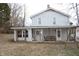 Two-story house with covered porch and backyard at 310 Green St, Plainfield, IN 46168