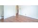 Empty living room features hardwood floors and an archway leading to another room at 310 Green St, Plainfield, IN 46168