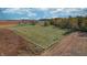 Aerial view of a farm with green fields, white fences, and grazing livestock at 3101 E State Road 47, Lebanon, IN 46052