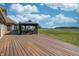 Expansive backyard deck featuring outdoor seating and views of the surrounding yard at 3101 E State Road 47, Lebanon, IN 46052