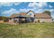 Spacious backyard with patio, outdoor seating, lawn and mature trees, perfect for outdoor entertaining at 3101 E State Road 47, Lebanon, IN 46052