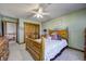 Bedroom featuring wood furniture, carpet, closet, and natural light at 3101 E State Road 47, Lebanon, IN 46052