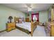 Charming bedroom featuring wood furniture, window and carpet at 3101 E State Road 47, Lebanon, IN 46052