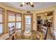 Bright breakfast nook featuring a wood table, with views to the home interior and to the exterior deck at 3101 E State Road 47, Lebanon, IN 46052