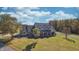 Lovely home with a welcoming front porch surrounded by a lush lawn and mature trees at 3101 E State Road 47, Lebanon, IN 46052