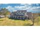 Charming two-story home featuring a cozy front porch, complemented by a well-manicured lawn at 3101 E State Road 47, Lebanon, IN 46052