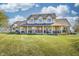 Expansive home featuring a large front porch, spacious lawn, and traditional design elements at 3101 E State Road 47, Lebanon, IN 46052