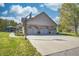 Charming home with a basketball hoop, 3-car garage, and a well-maintained lawn at 3101 E State Road 47, Lebanon, IN 46052