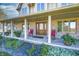 Inviting front porch with rocking chairs and flower planters, creating a welcoming entrance at 3101 E State Road 47, Lebanon, IN 46052