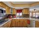 Charming kitchen featuring wood cabinets, granite counters, and stainless steel appliances at 3101 E State Road 47, Lebanon, IN 46052