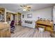 Inviting living room with a comfortable couch, piano, wood floors, and built-in bookshelves at 3101 E State Road 47, Lebanon, IN 46052