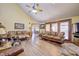 Inviting living room featuring a vaulted ceiling, wood floors, and comfortable seating at 3101 E State Road 47, Lebanon, IN 46052