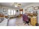 Comfortable living room features wood floors, lots of natural light, and an antique desk at 3101 E State Road 47, Lebanon, IN 46052