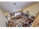 Bright living room with high ceilings, a ceiling fan, and a stone fireplace at 3101 E State Road 47, Lebanon, IN 46052