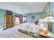 Spacious main bedroom with colorful accents, carpet, and a large window for natural light at 3101 E State Road 47, Lebanon, IN 46052