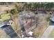 Aerial view of house, pool, and tennis court at 3301 Timberbrook Ct, Danville, IN 46122