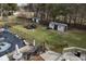 Large backyard with inground pool, deck, sheds, and chain link fence at 3301 Timberbrook Ct, Danville, IN 46122