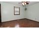 Light green bedroom with wood floors and ceiling fan at 3301 Timberbrook Ct, Danville, IN 46122
