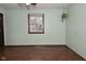 Light green bedroom with wood floors and hanging planter at 3301 Timberbrook Ct, Danville, IN 46122