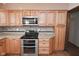 Kitchen features double oven and wood cabinets at 3301 Timberbrook Ct, Danville, IN 46122