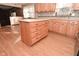 Kitchen island with drawers and hardwood floors at 3301 Timberbrook Ct, Danville, IN 46122