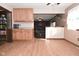 Kitchen with breakfast bar and view into living room at 3301 Timberbrook Ct, Danville, IN 46122