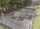 Damaged tennis court with chain link fence at 3301 Timberbrook Ct, Danville, IN 46122
