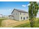 Home's backyard featuring a spacious lawn and a two-story home at 349 N Post Oak Dr, Mooresville, IN 46158