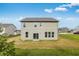 A view of the home's backyard with a well-manicured lawn and a patio at 349 N Post Oak Dr, Mooresville, IN 46158