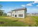 Backyard view highlights the home's expansive lawn and open layout at 349 N Post Oak Dr, Mooresville, IN 46158