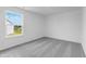Bright bedroom features gray carpet and a picturesque neighborhood view at 349 N Post Oak Dr, Mooresville, IN 46158