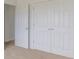 Spacious bedroom with double doors and carpet flooring at 349 N Post Oak Dr, Mooresville, IN 46158